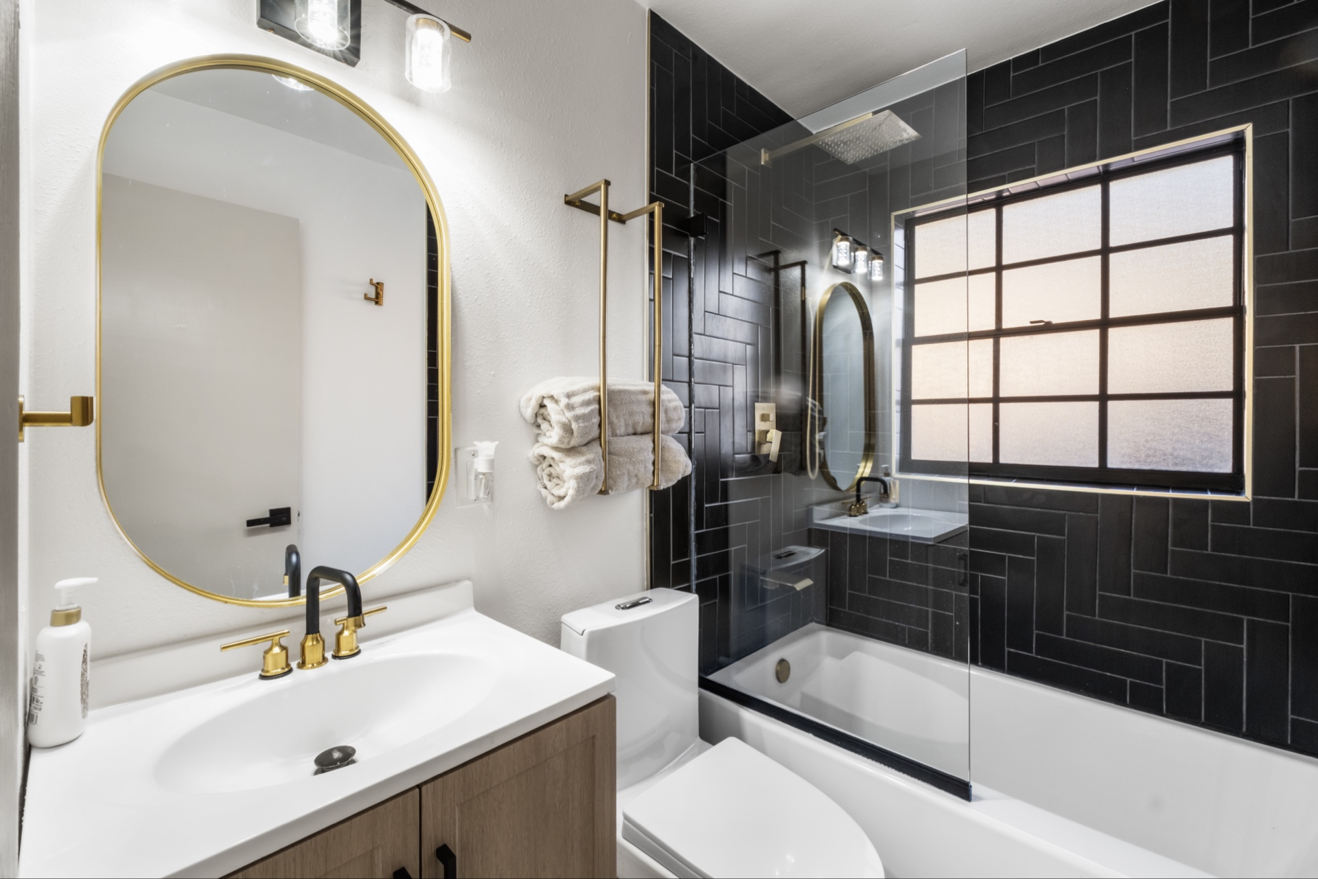 Guest Bath — Black Herringbone & Gold Fixtures